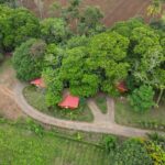 Manicured property with small river, natural mineral pond, and views of Arenal Volcano in Chachagua near La Fortuna Costa Rica la fortuna costa rica real estate arenal volcano hot springs prime location airbnb income property