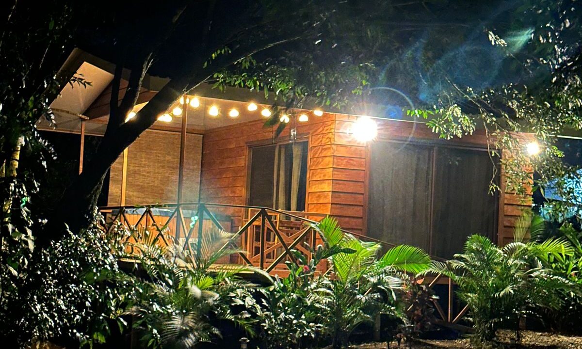 Cedar wood studio cabin with private jacuzzi and patio overlooking mineral pond and Arenal Volcano in Chachagua rental property