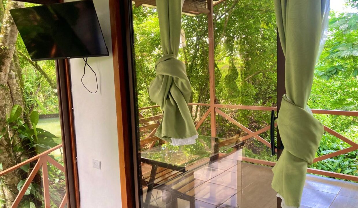 Cabin Bedroom with Scenic Outdoor Views in Chachagua Near Arenal Volcano