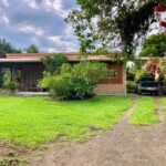 Charming cedar home in La Fortuna Costa Rica, fronting lush rainforest front yard