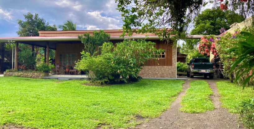 Charming cedar home in La Fortuna Costa Rica, fronting lush rainforest front yard