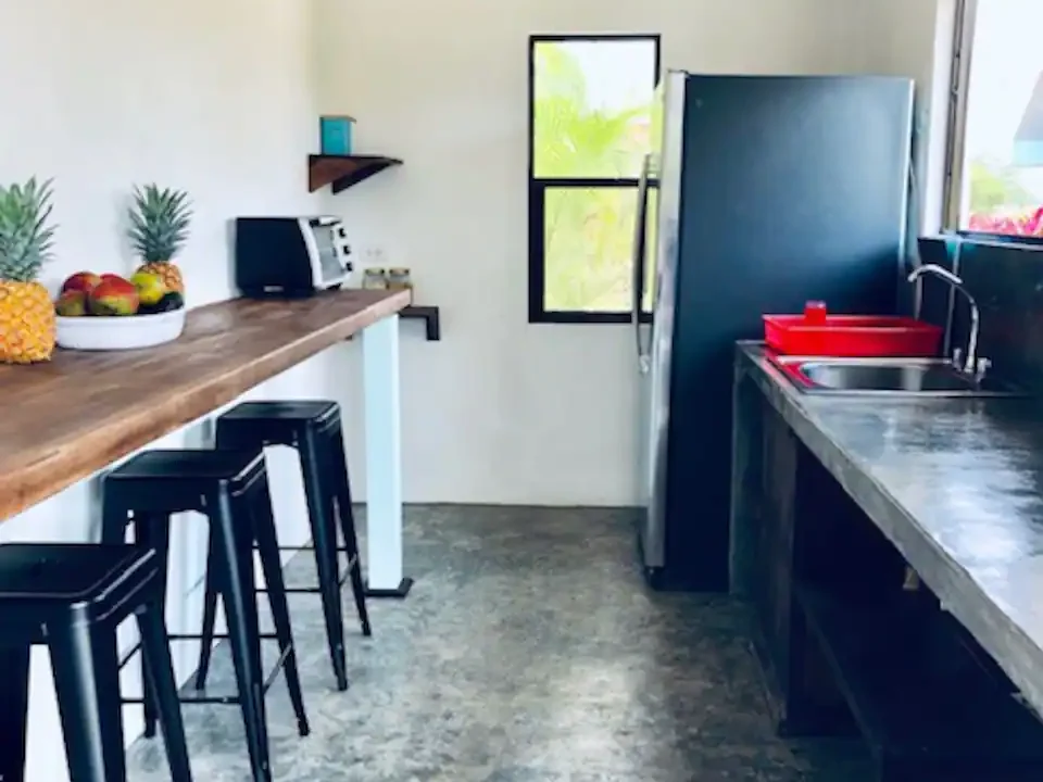Shared Kitchen with Dining Area in La Fortuna Costa Rica Villa la fortuna costa rica real estate agent arenal volcano hot springs income property airbnb