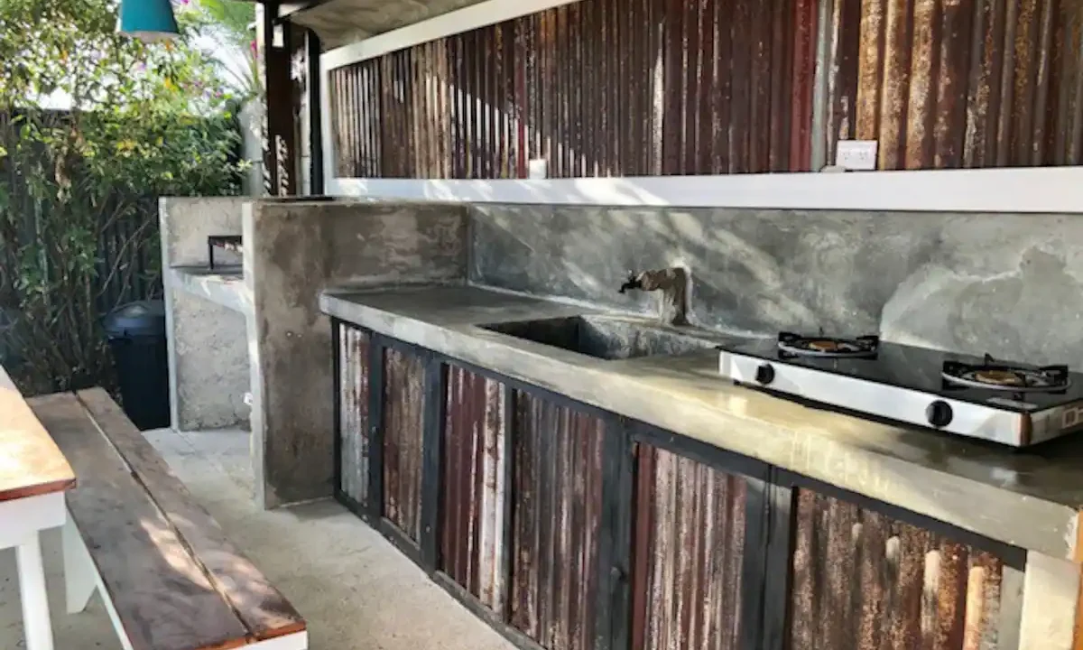 Fully equipped shared kitchen with Argentinian grill and dining area in La Fortuna Costa Rica