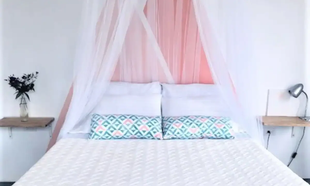 Pink House Studio with Arenal Volcano View in La Fortuna Costa Rica bed