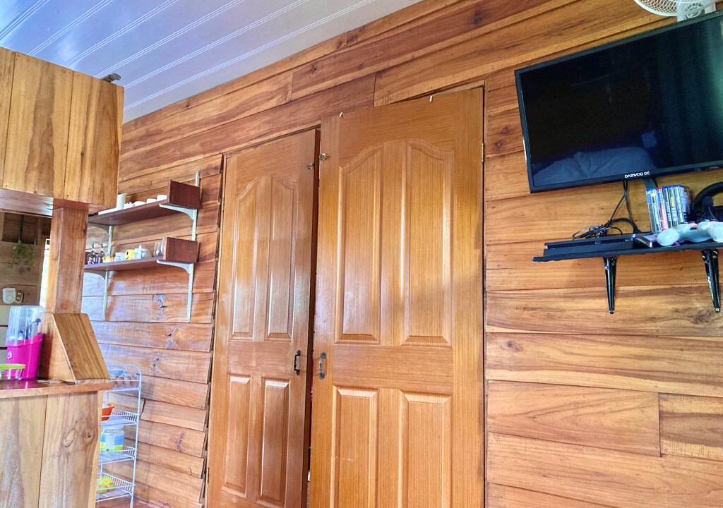 Interior wood-panel living area in La Fortuna Costa Rica real estate