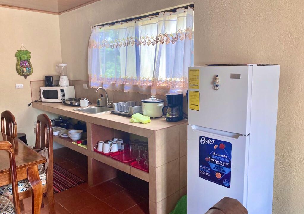 La Fortuna furnished kitchen, Costa Rica rental home kitchen, Airbnb kitchen La Fortuna, Arenal Volcano property kitchen, turnkey homes Costa Rica, kitchen with appliances La Fortuna, real estate with equipped kitchen Costa Rica