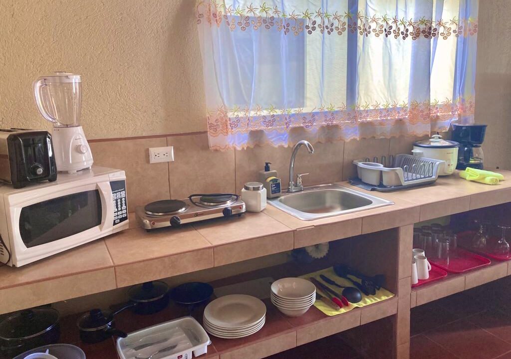 La Fortuna furnished kitchen, Costa Rica rental home kitchen, Airbnb kitchen La Fortuna, Arenal Volcano property kitchen, turnkey homes Costa Rica, kitchen with appliances La Fortuna, real estate with equipped kitchen Costa Rica