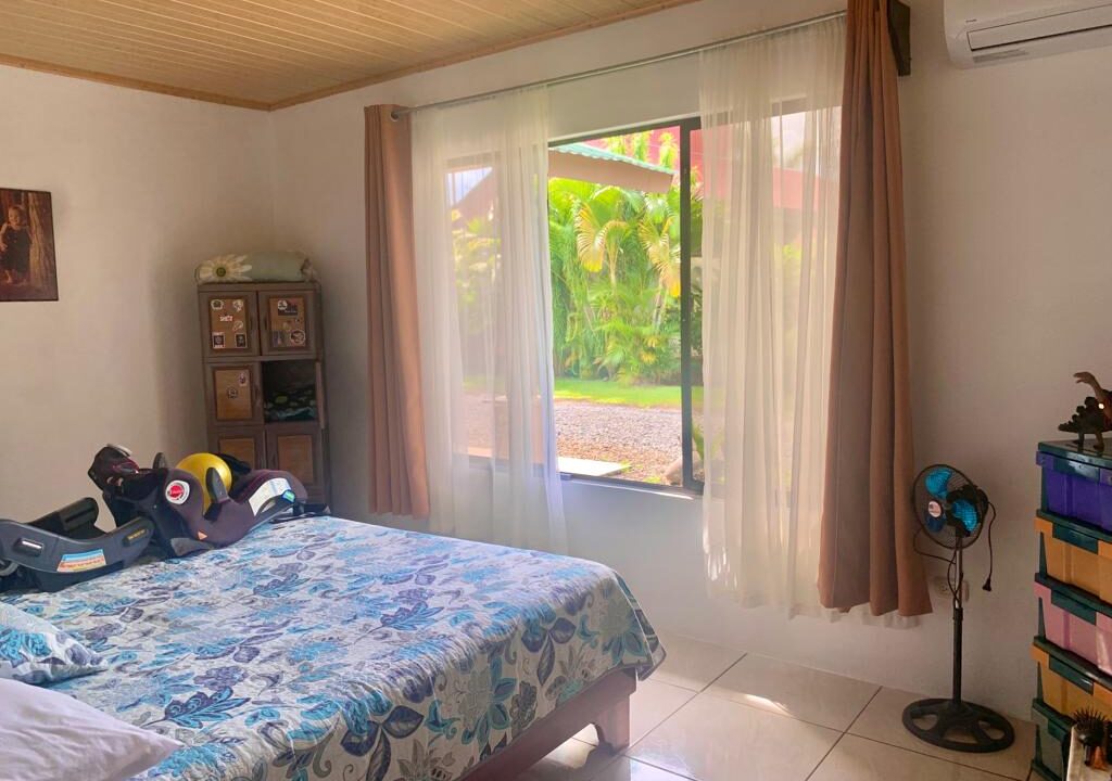 Airbnb-style bedroom in La Fortuna real estate near Arenal Volcano