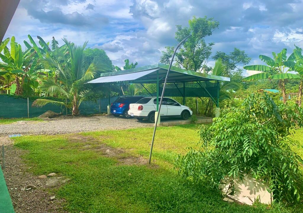 Secure carport with tropical landscaping near Arenal Volcano