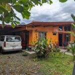 Exterior of La Fortuna duplex for sale – 6-bedroom Airbnb-ready property with volcano views. La Fortuna real estate income property arenal volcano