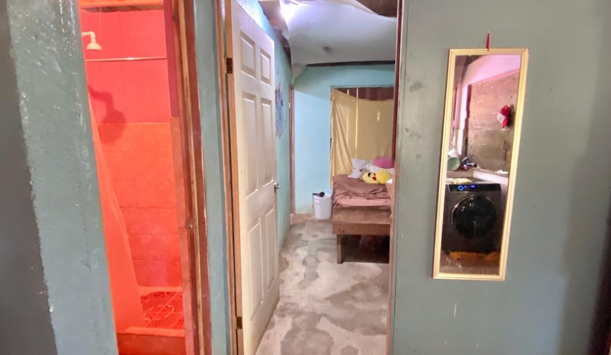 Main floor bedroom needing renovation near downtown La Fortuna Costa Rica