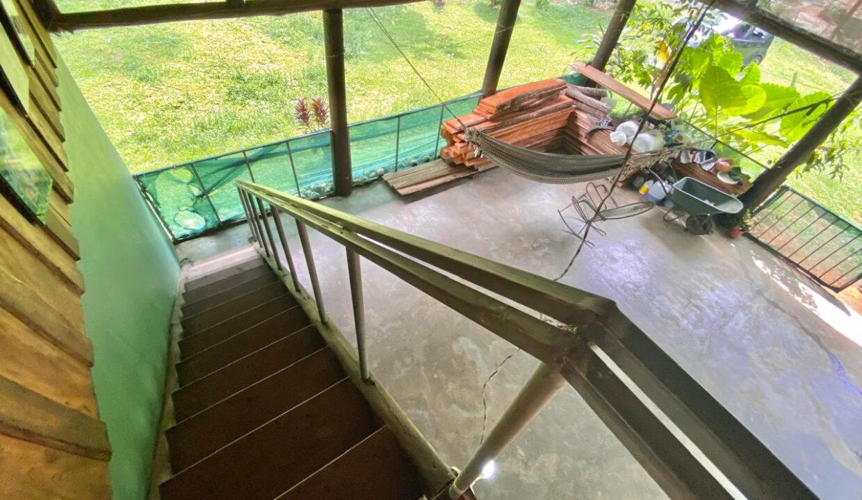 Rustic staircase to jungle-view patio with hammock near Arenal Volcano – La Fortuna Costa Rica – Tropical Glow