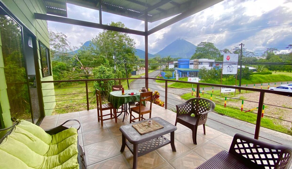 Spacious upper terrace with comfortable outdoor setup and Arenal Volcano views in La Fortuna