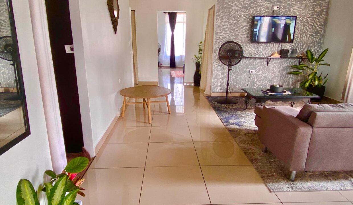 Modern design with decorative accent wall and open layout in La Fortuna volcano-view penthouse