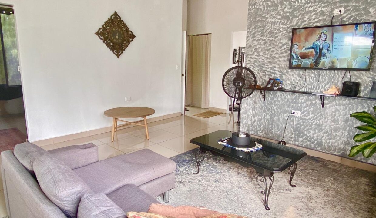 Stylish living space with modern decor and entertainment setup in La Fortuna volcano-view penthouse