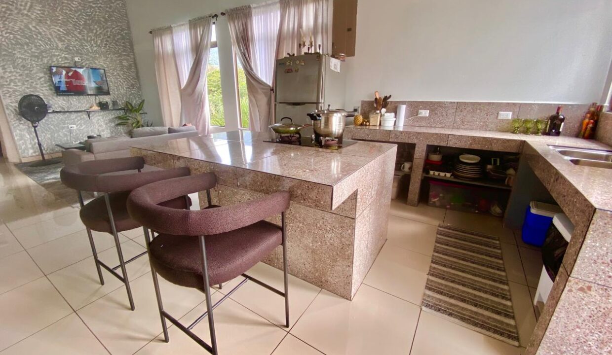 Modern granite countertop with natural light in La Fortuna penthouse kitchen