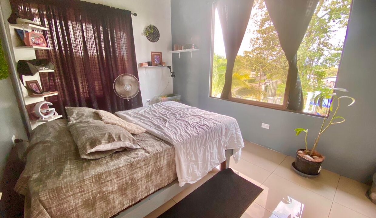 Stylish upstairs guest room with premium furniture and decor in La Fortuna volcano-view penthouse