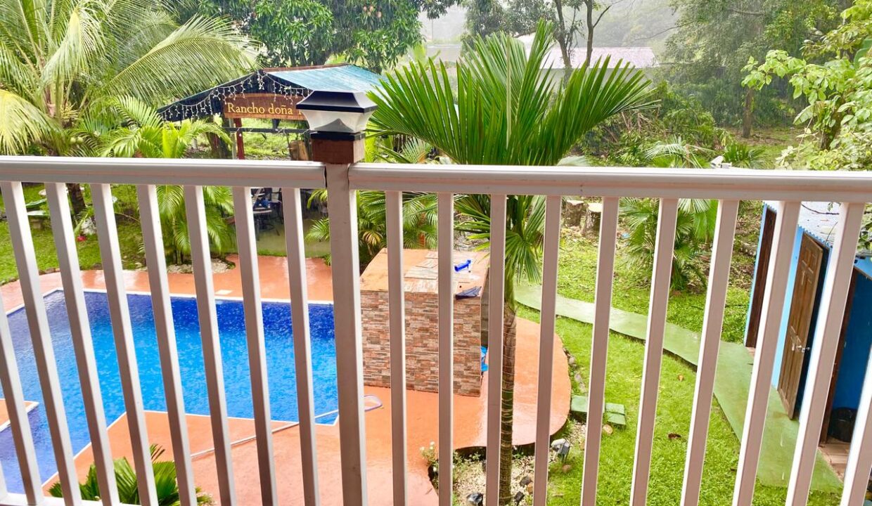 Upper floor terrace overlooking tropical real estate near La Fortuna in Chachagua