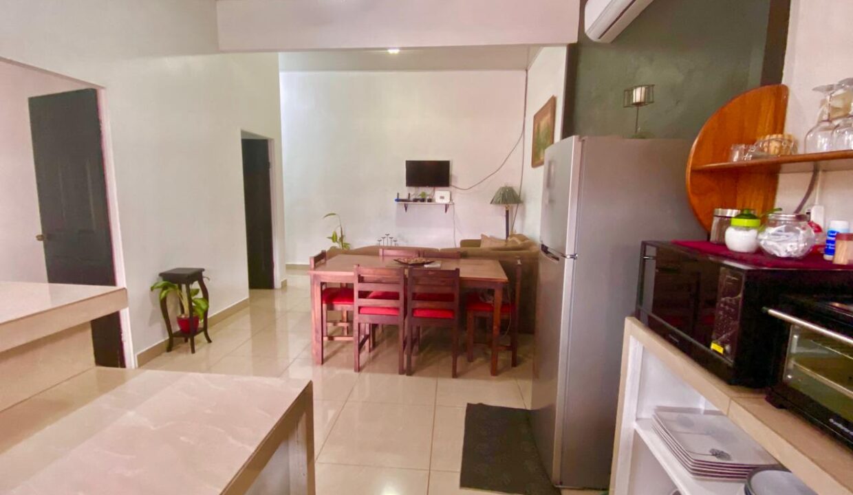 Fully equipped rental unit with microwave, toaster oven, and open-plan living area in La Fortuna