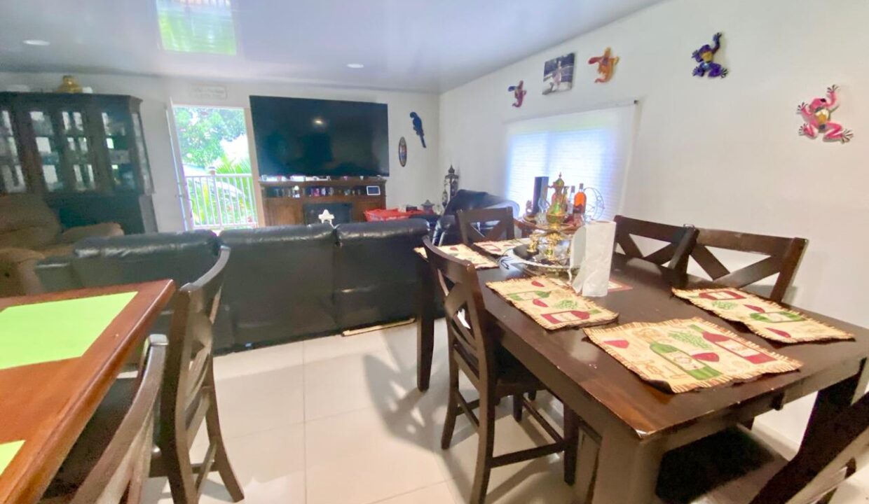 Furnished indoor living near La Fortuna with smart layout, TV lounge and dining space in tropical duplex