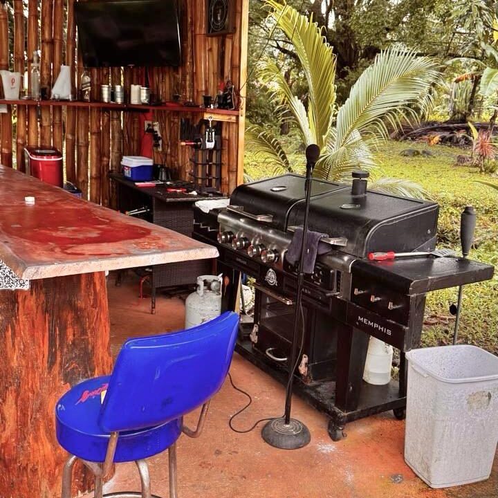 Rancho BBQ setup with full outdoor kitchen and TV in real estate near La Fortuna Costa Rica