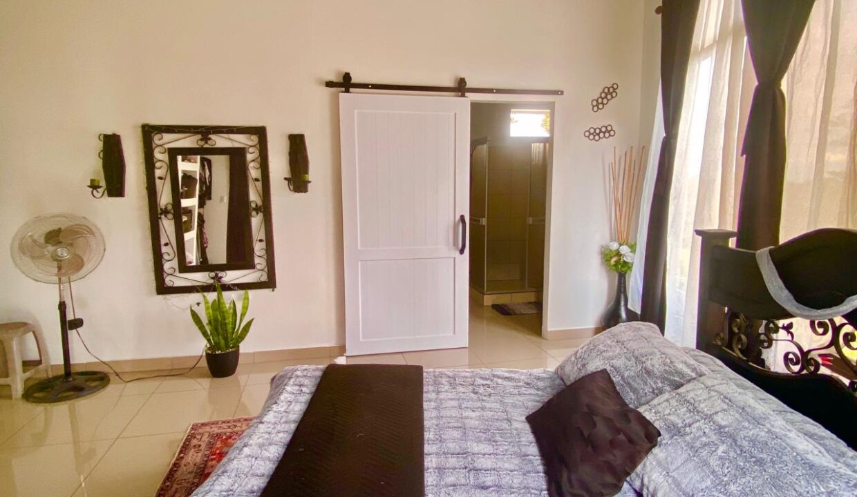 Fully furnished bedroom with ensuite bathroom in La Fortuna penthouse unit