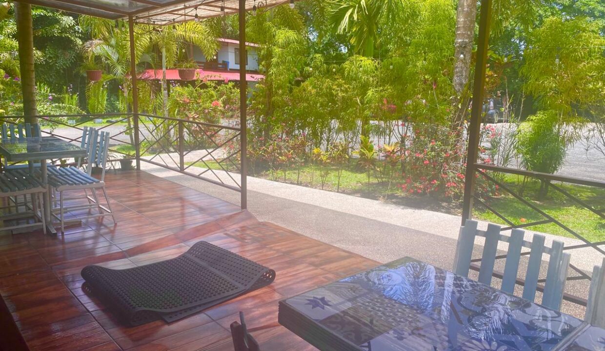      Outdoor dining area at La Fortuna hotel for sale near Arenal Volcano - Tropical Glow