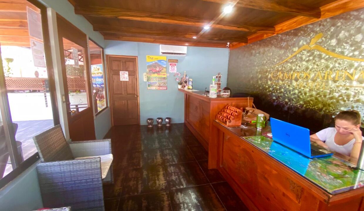  Reception desk and lobby at La Fortuna hotel for sale - Tropical Glow