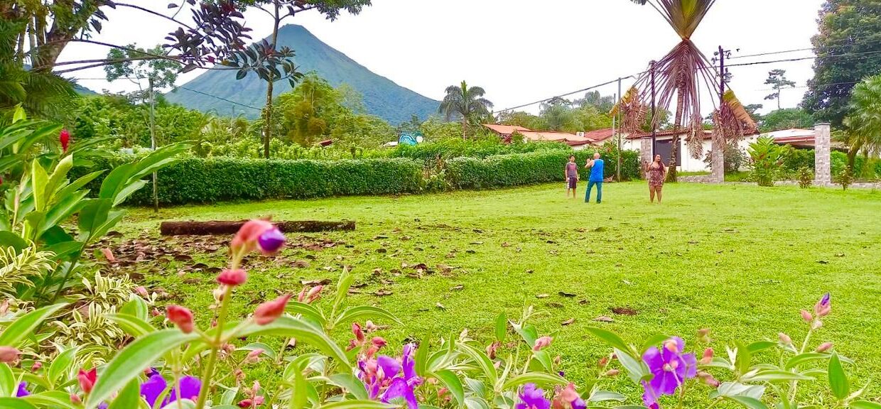 La Fortuna land listing near Arenal Volcano with scenic views and development-ready open space tropical glow