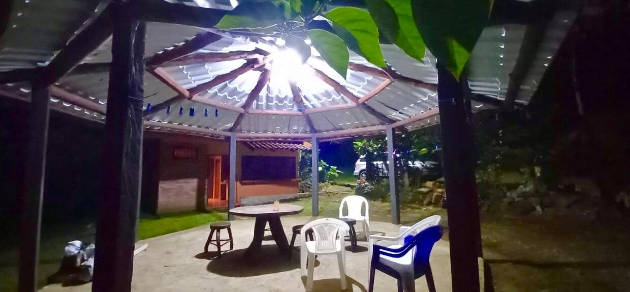 Covered rancho lit for evening use on prime land near La Fortuna waterfall and hot springs