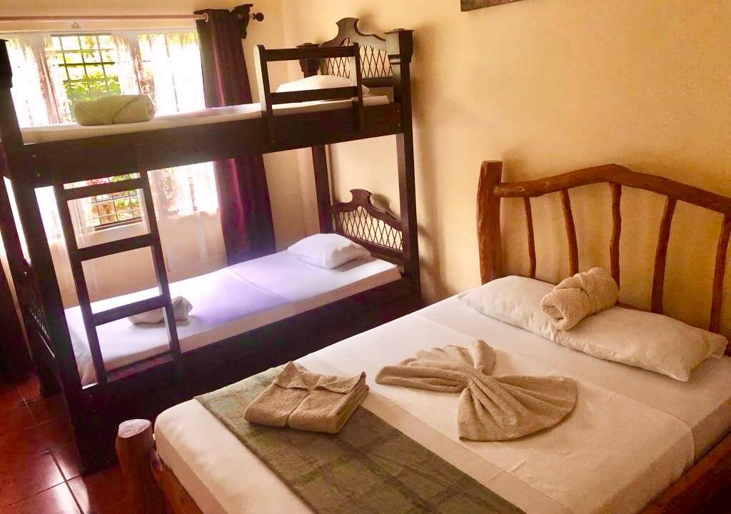 Family-style bedroom setup on property for sale near Arenal Volcano and La Fortuna waterfall