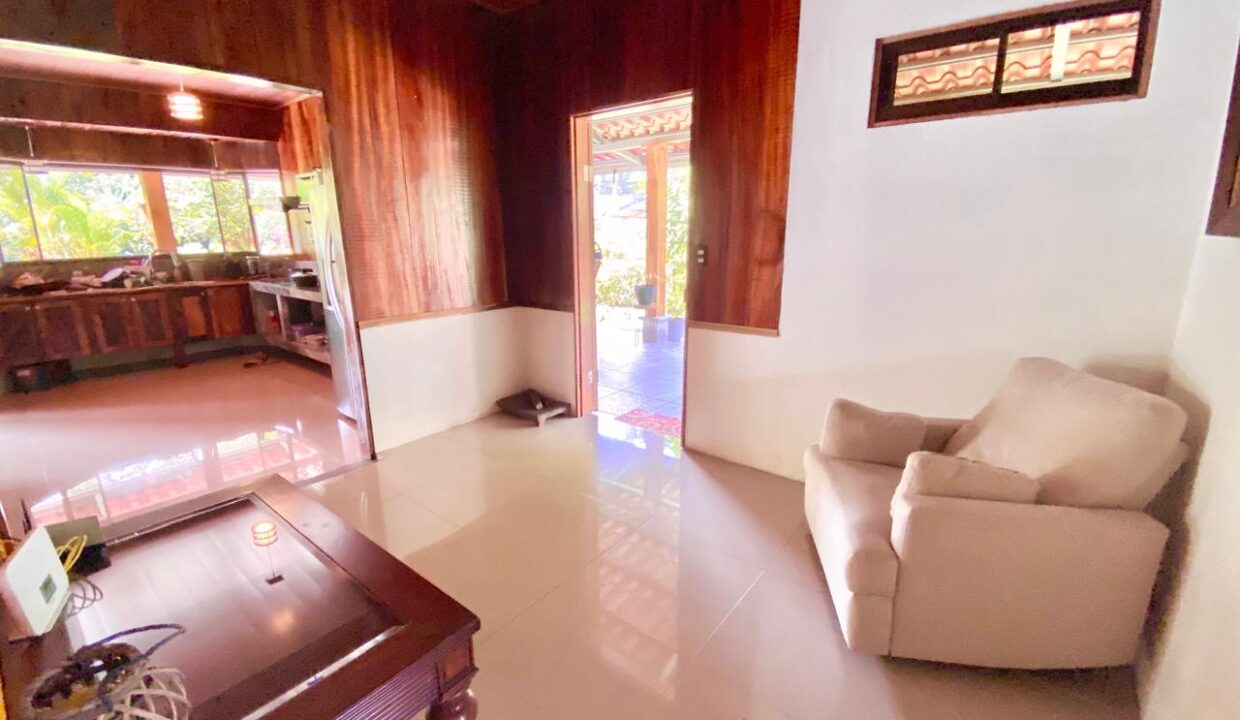 Cozy indoor sitting area with hardwood finishes near Arenal Volcano real estate