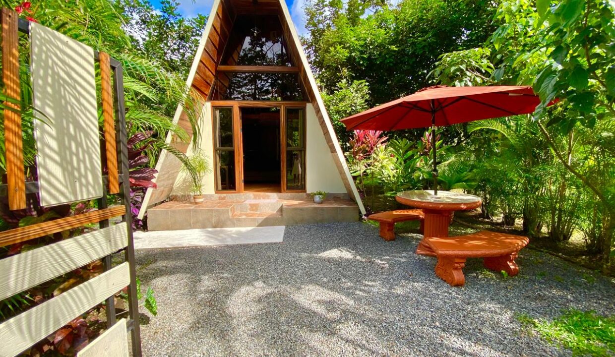 Modern A-frame guest cabin with shaded patio near Arenal Volcano Costa Rica