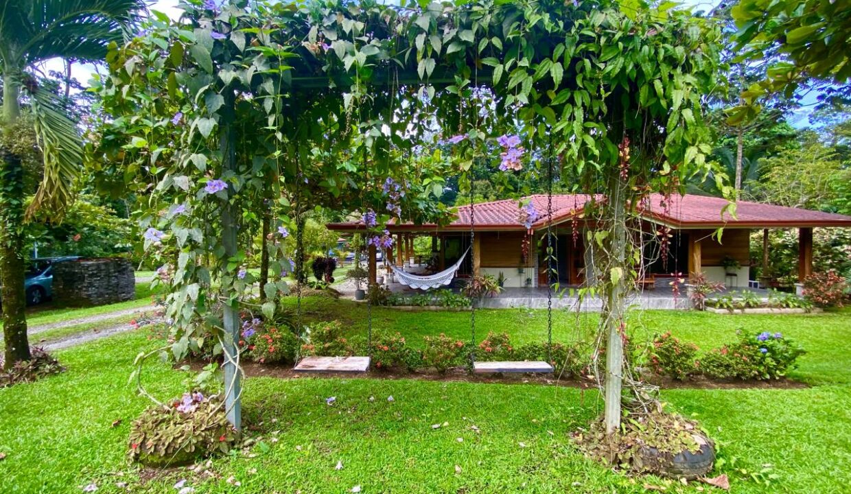 Relaxing garden swing and veranda near Arenal Volcano real estate