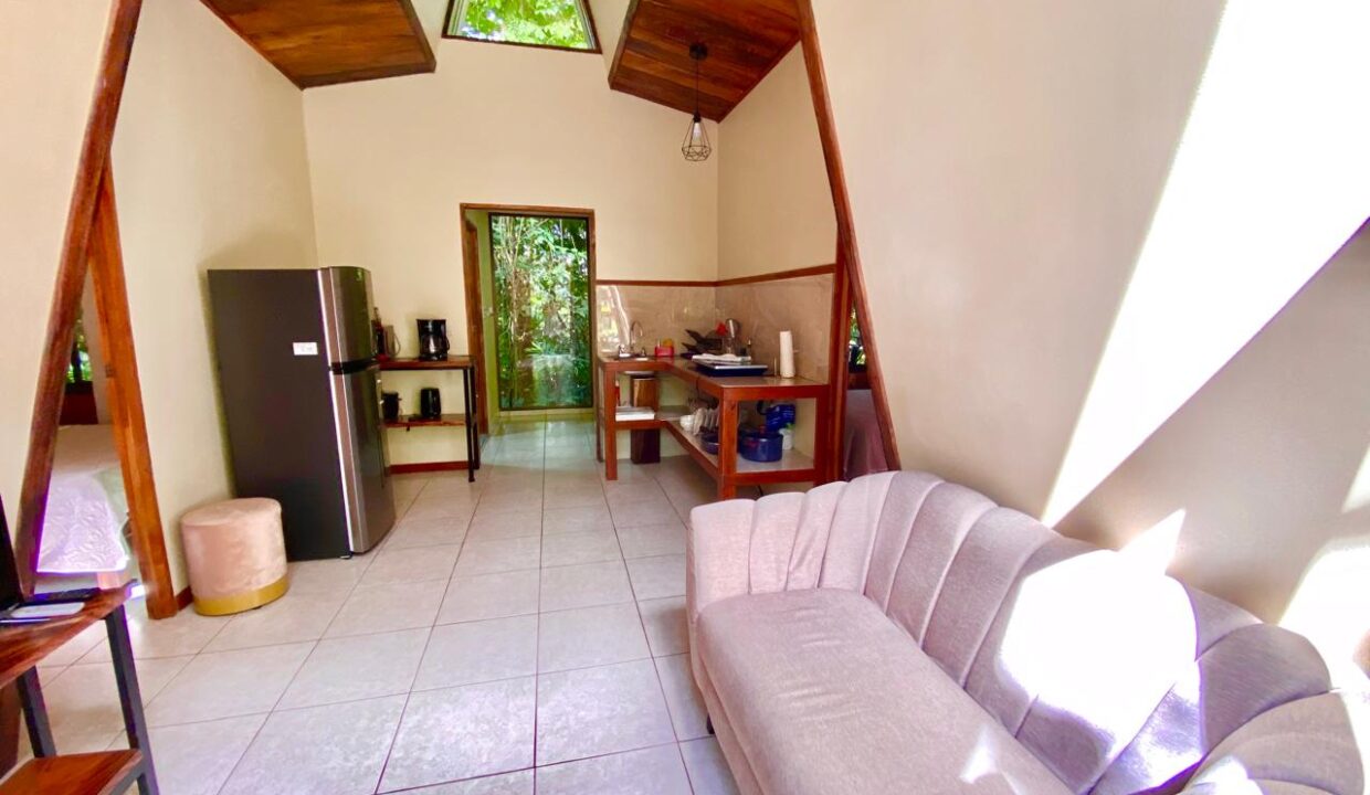 Minimalist living space with high ceilings and natural light near Arenal Volcano