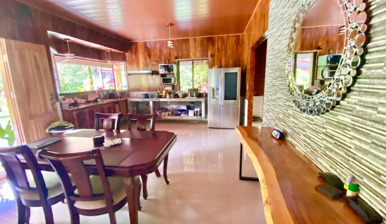 Polished wood cabinetry and modern appliances near Arenal Volcano real estate