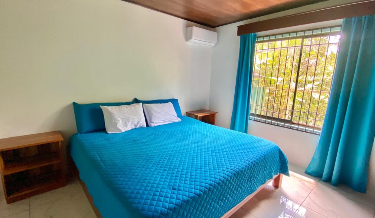 La Fortuna Costa Rica income property Elegant master suite with custom wood wardrobe in Jauuri rental home