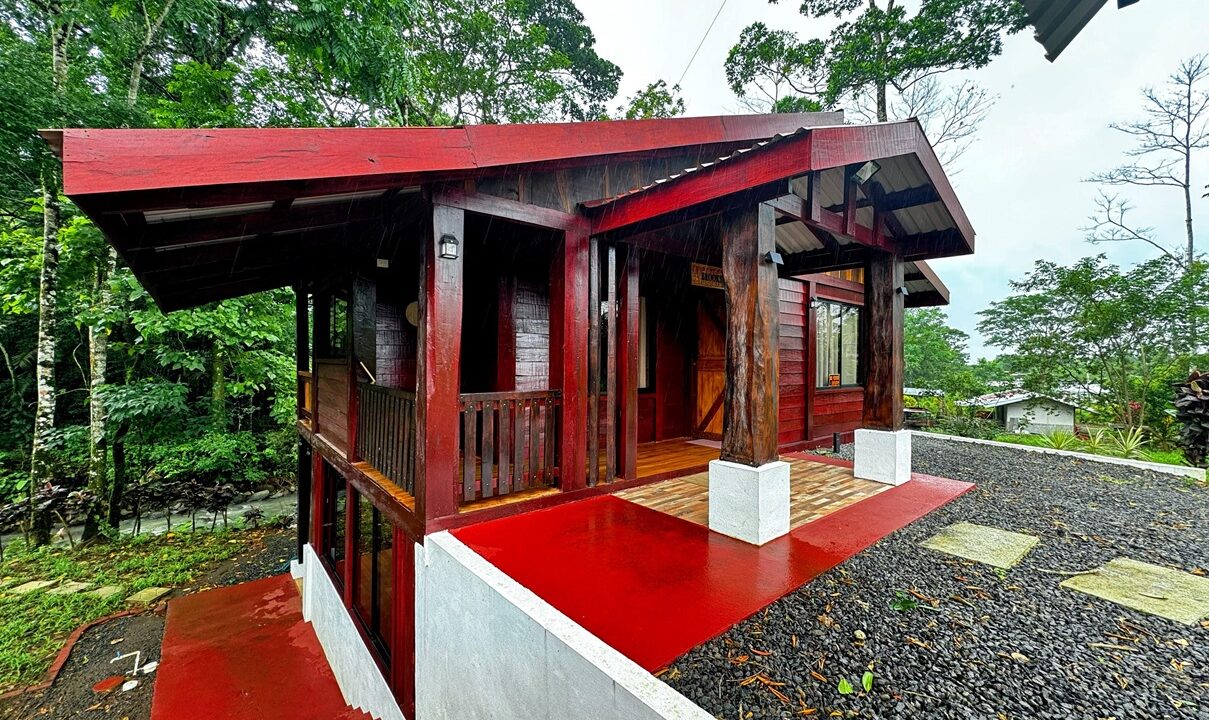 2Exterior view of elevated Costa Rica home with spacious covered dining area, near La Fortuna and Ciudad Quesada by a river.