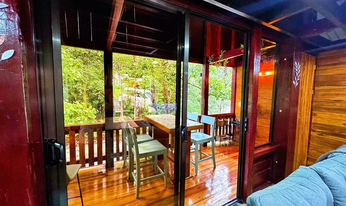 La Fortuna Costa Rica real estate with private terrace and river view. Rustic yet modern property perfect for vacation rental or retirement.